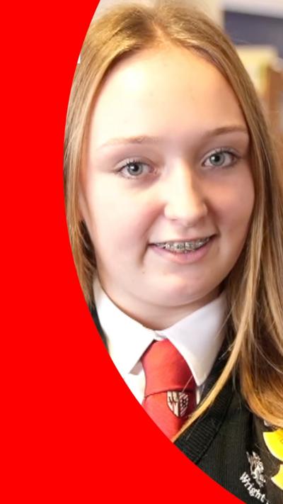A student wearing braces looking at the camera 