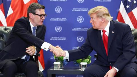 Andy Burnham shaking hands with Donald trump