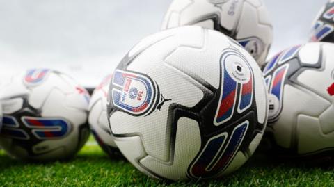 A selection of footballs with EFL branding