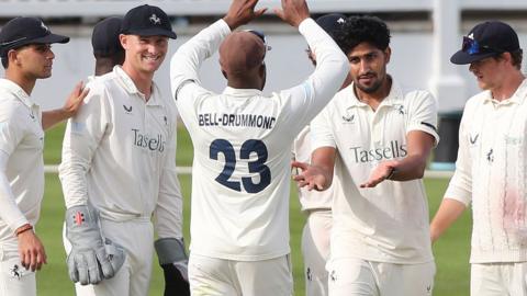 Kent players celebrate taking a wicket