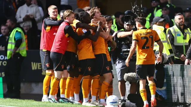 Wolverhampton Wanderers players celebrate Fer Lopez's goal during the Black Country derby with West Bromwich Albion in front of their home crowd on Sunday