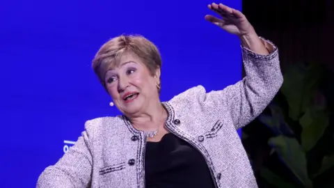 Kristalina Georgieva, managing director of the IMF, speaking during the Qatar Economic Forum in New York, US, this month. She sitting down in a chair explaining her answer to a question as she raises her left arm above her head.